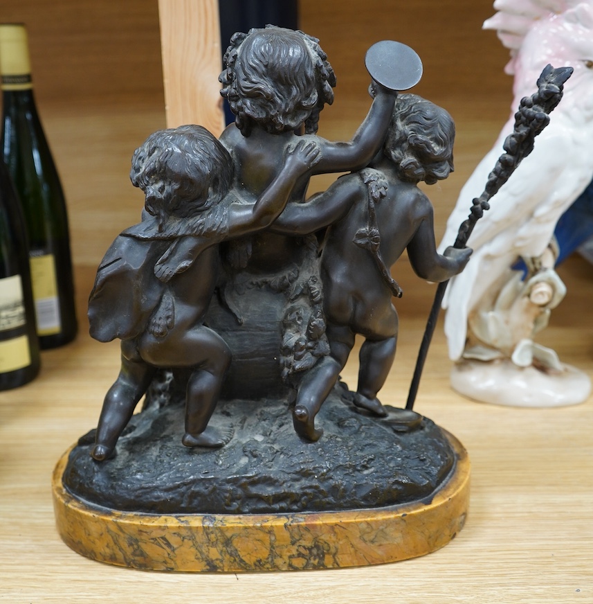 After Claude Michel Clodion (1738-1814), a bronze group of three Bacchanalian cherubs on sienna marble base, 31cm. Condition- fair to good